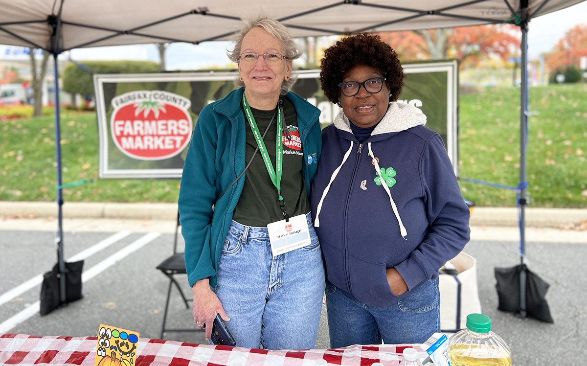 Photo of two women working at a Fairfax County Farmer's Market booth.