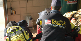 Image of the back of person wearing a jacket with the text "Fairfax County Urban Search and Rescue" 